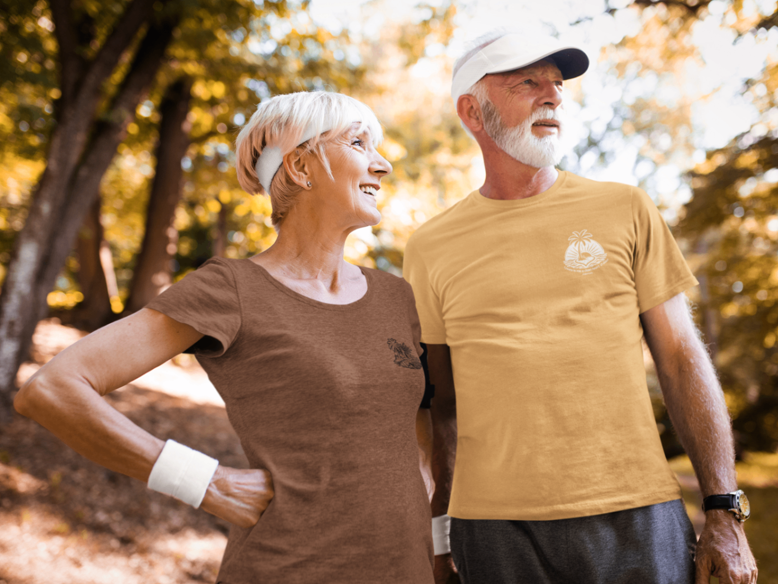 A senior couple walking outdoors in Pocket Psalms tees